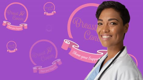 animation of breast cancer awareness text over smiling african american female doctor