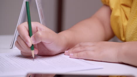 close-up of a woman reading and meticulously proofreading an article while doing a thorough editing of a written work