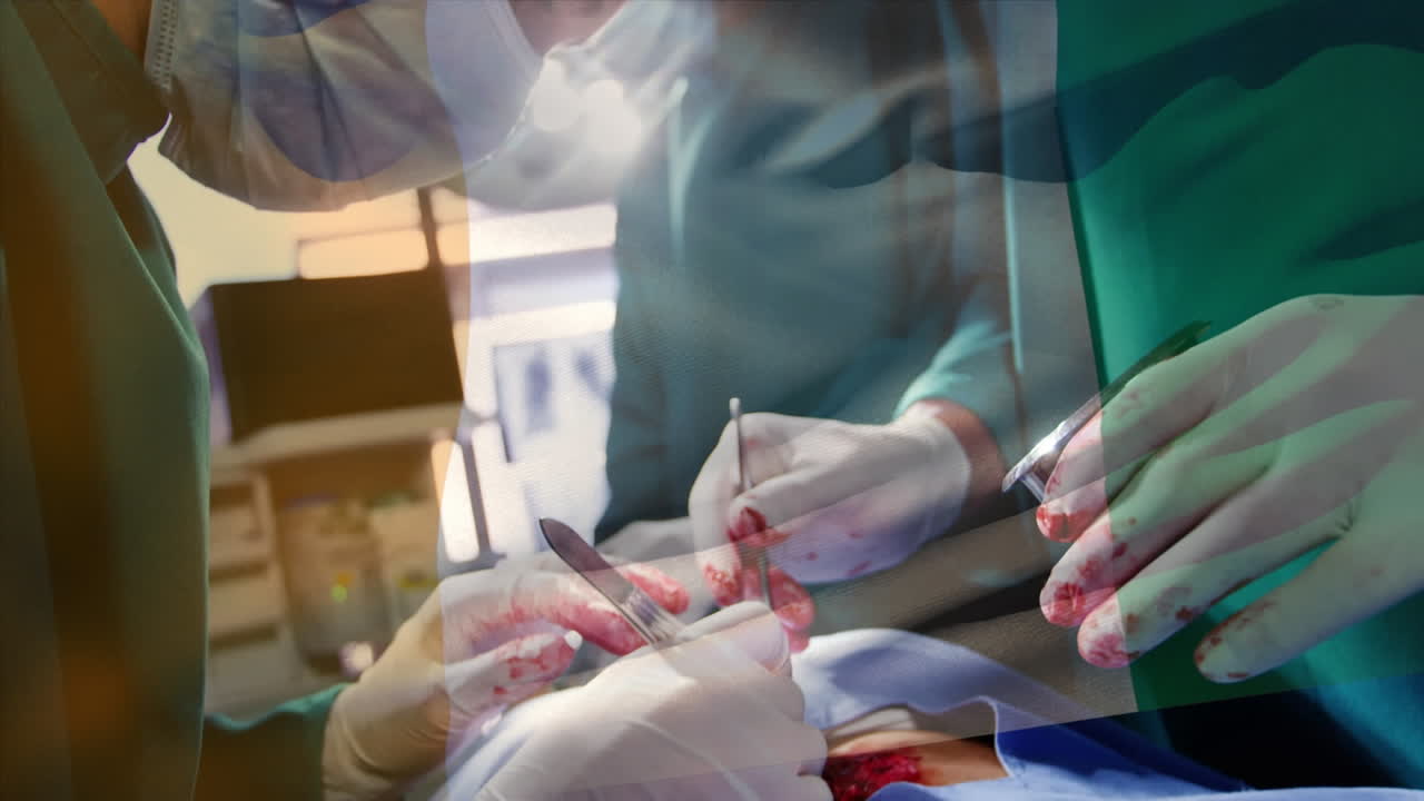 Animation of flag of the republic of cote divoireover surgeons in operating theatre