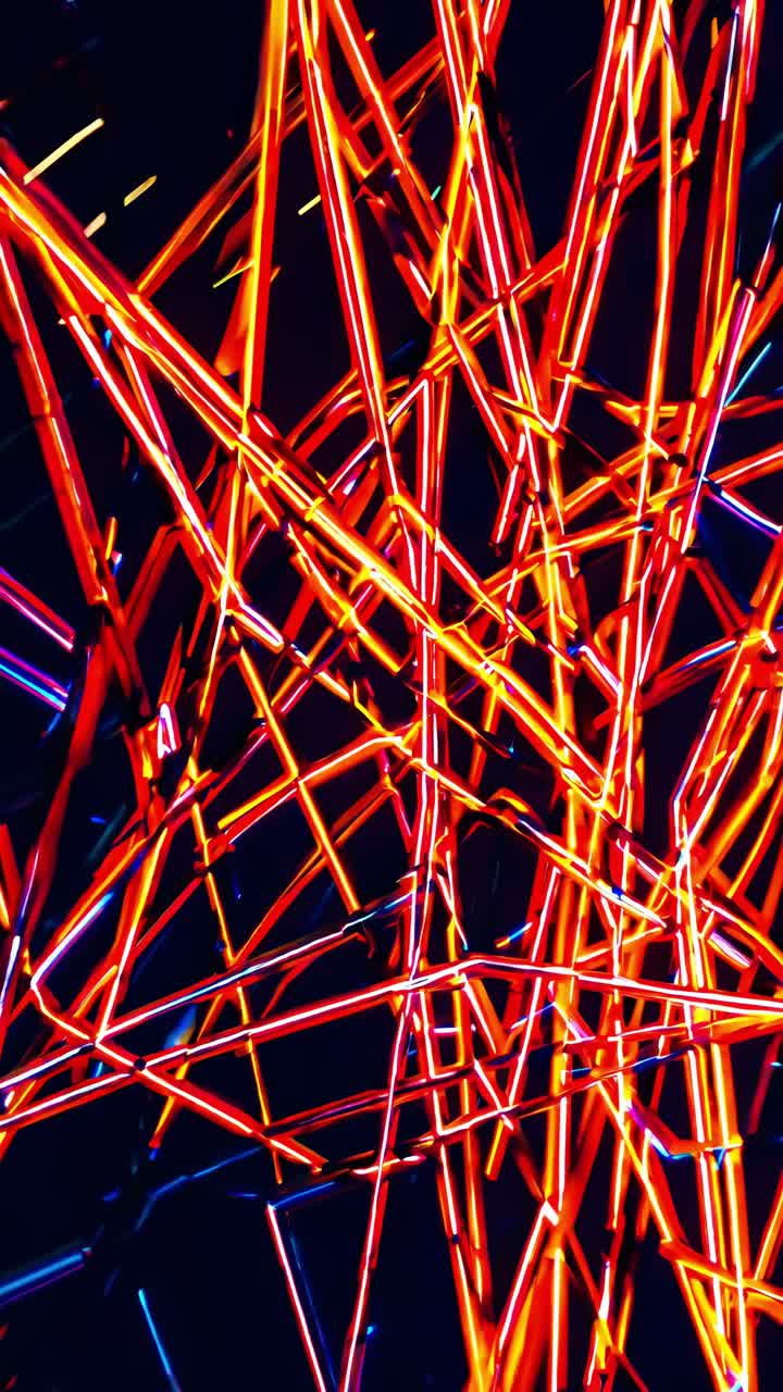 Colorful neon lights intersecting in vibrant hues of orange, red, and blue against a dark background, creating a dynamic visual experience filled with energy and rhythm