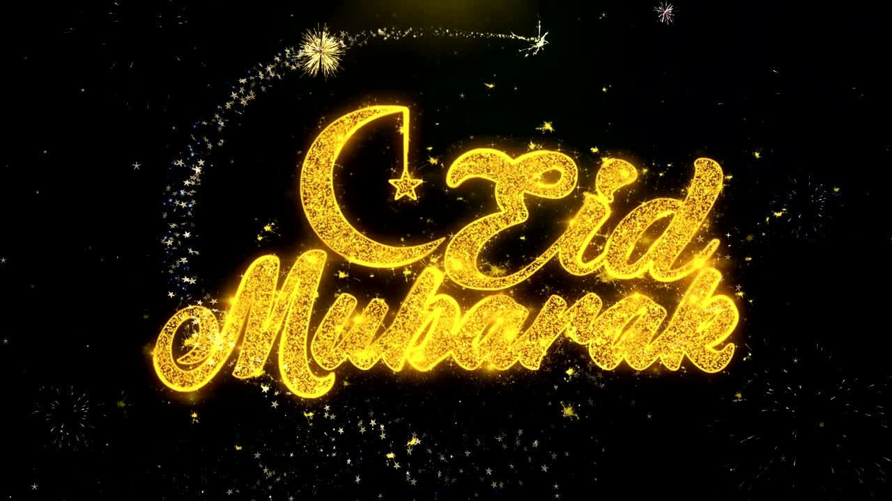 eid mubarak deseo de texto en las partículas de oro exhibición de fuegos artificiales.