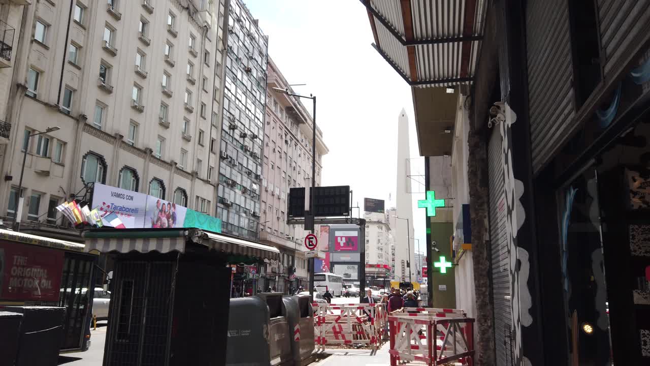 Panoramic at Corrientes avenue, famous theater and nightlife avenue in Buenos Aires city during working daylight