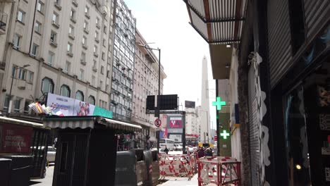 panoramic at corrientes avenue, famous theater and nightlife avenue in buenos aires city during working daylight