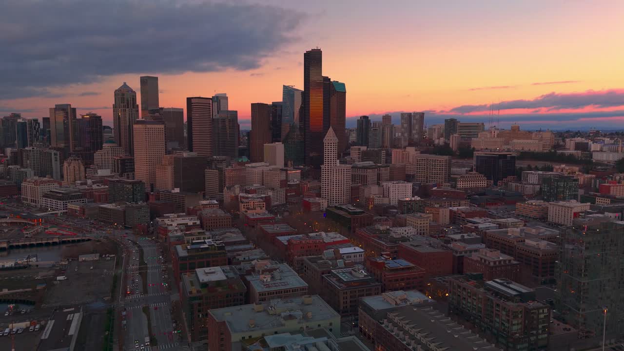 Establishing drone shot of Seattle's downtown skyscrapers at sunset