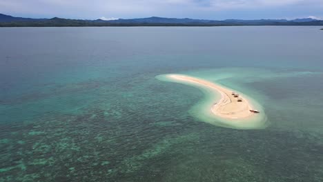 aerial footage of a small island, a sand bar in roxas, palawan