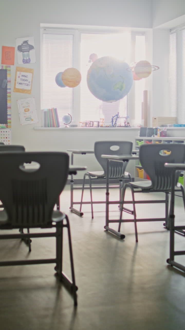 Interior of Modern Empty Elementary School Classroom with Desks for Students