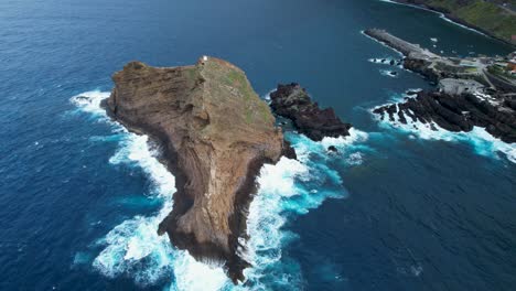 farol do ilhéu establishing aerial view over island lighthouse surrounded by atlantic ocean seascape