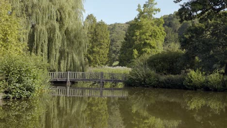 static shot of bridge over pond at chartwell, the country house near kent, england where winston churchill lived
