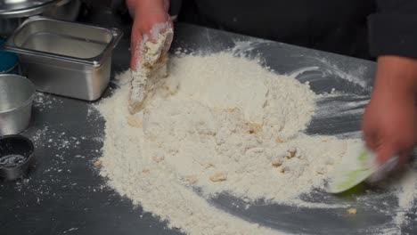 Chef-baker-cooker-preparing-dough-for-bread-at-gourmet-restaurant-kitchen-pan-mixing-recibe-bun-add-milk