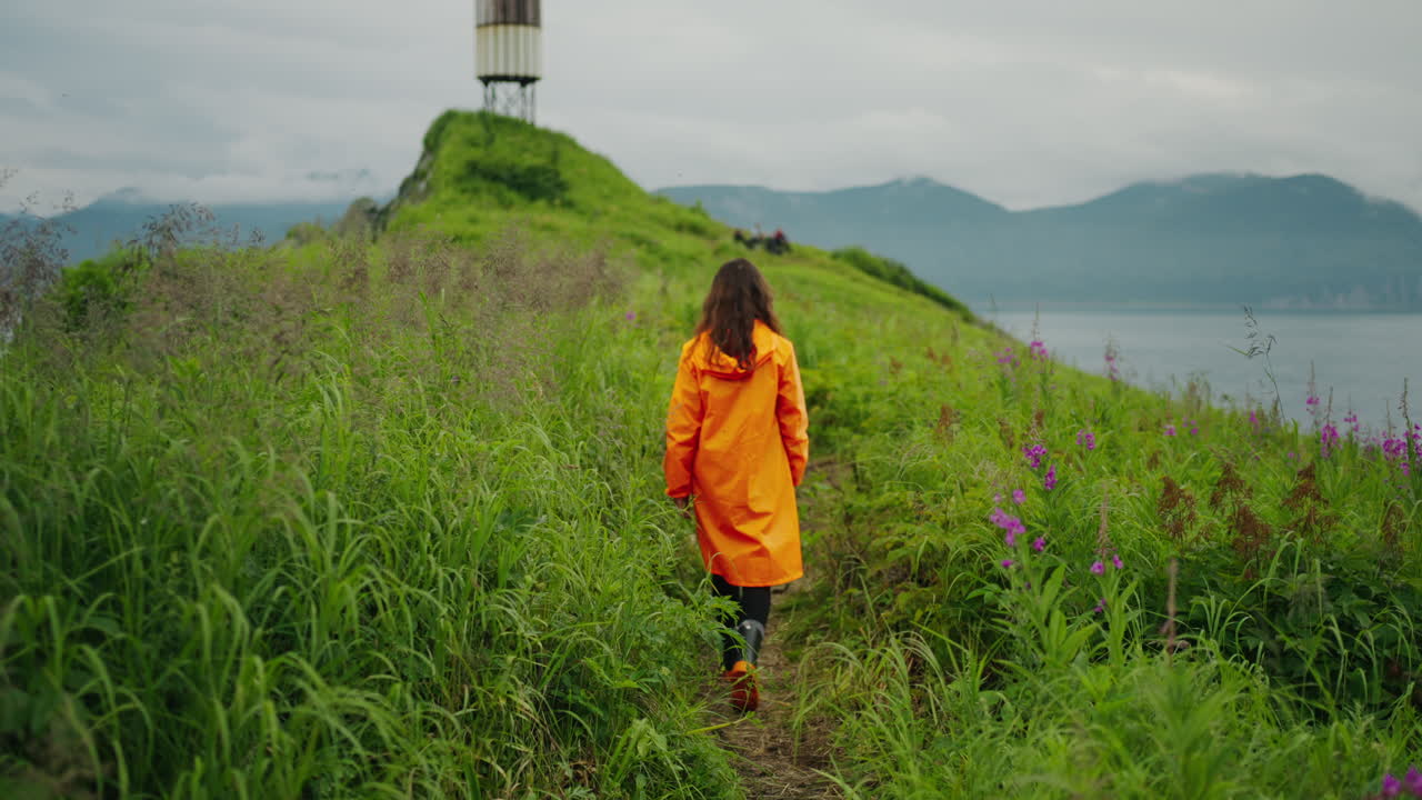 Woman Hiking on an Island Path