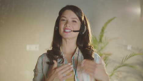 woman wearing headset, smiling and talking