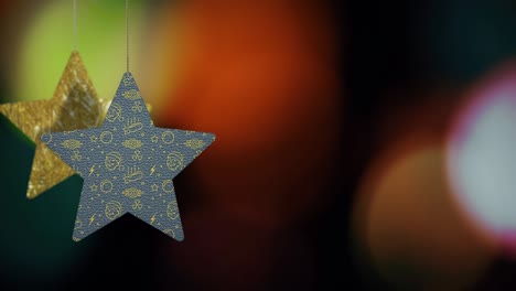 los adornos de las estrellas de navidad se mueven en el fondo de bokeh.