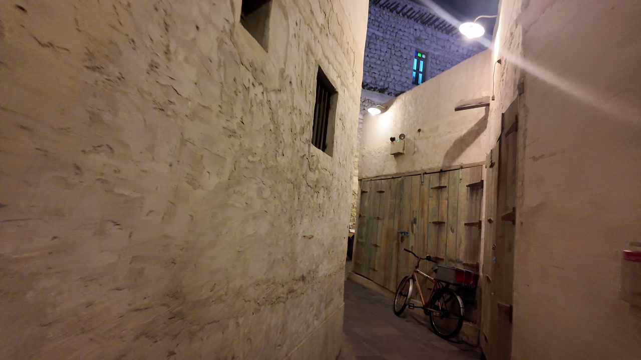 Narrow Alleyway in an Old Town at Night with Traditional Architecture