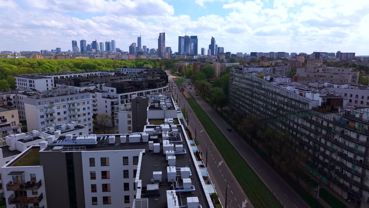 Aerial shot of modern residential buildings in Warsaw with the city skyline in the background