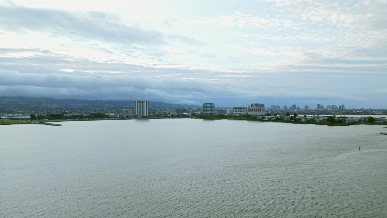 The Emeryville waterfront reveals peaceful trails, docks, and sailboats under golden afternoon light.