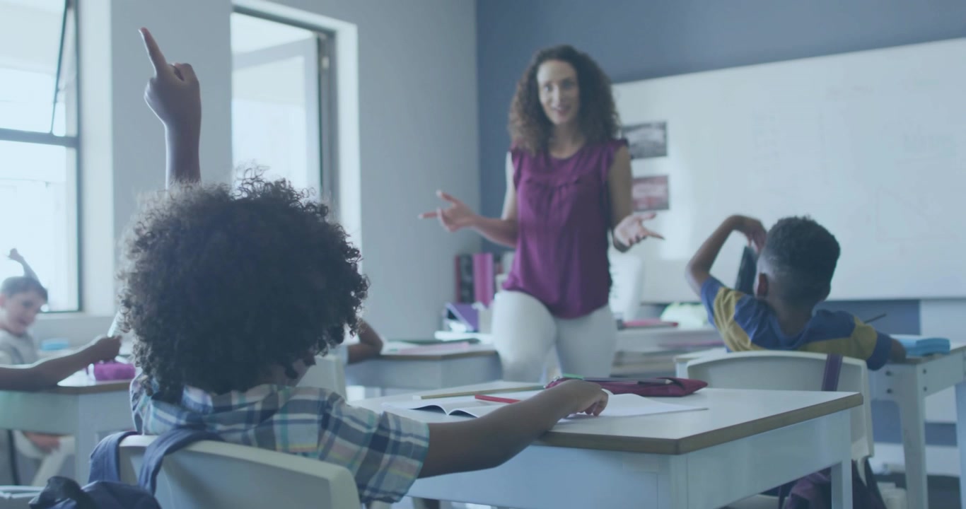 Teacher starting data lesson speaking while floating numbers appear in class student raising hand