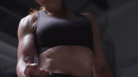 Close-Up-Studio-Shot-Of-Mature-Woman-Wearing-Gym-Fitness-Clothing-Exercising-With-Resistance-Band-3