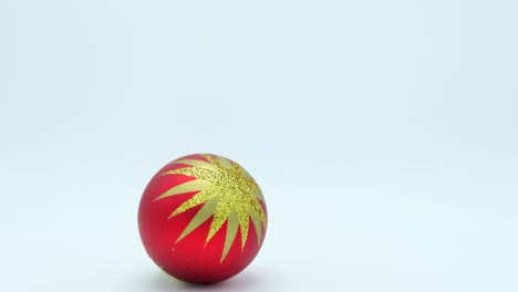 bola roja de navidad con estrella dorada brillante girando sobre un fondo blanco.
