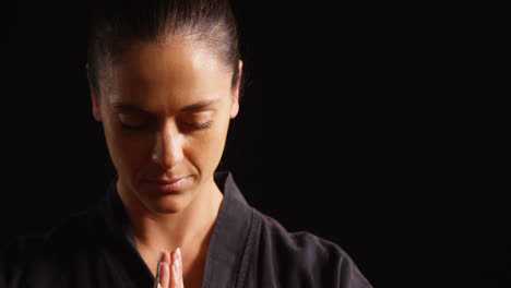 karate player in prayer pose