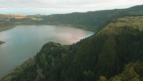 Wide-aerial-of-Furnas-lake-and-hilly-green-landscape-at-the-Azores