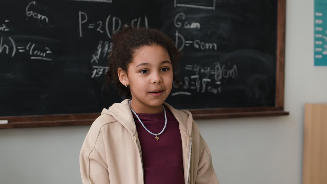 Young Girl Speaking in a Classroom