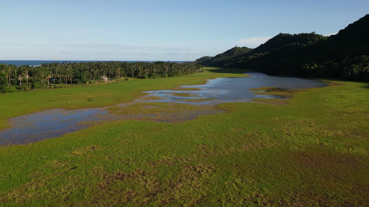 Coastal Wetlands In Antipolo, Seaside Town Of Virac In Catanduanes, Philippines. drone sideways shot