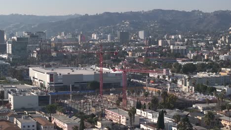 view of regeneration and two construction cranes in los angeles facing hollywood area