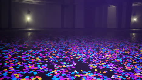 colorful confetti installation in a dark room
