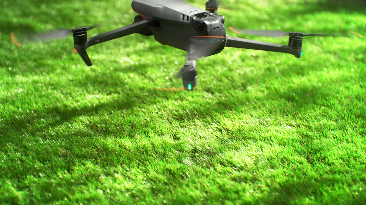Remotely Controlled Unmanned Aerial Vehicle Lands On Green Grass In Slow Motion