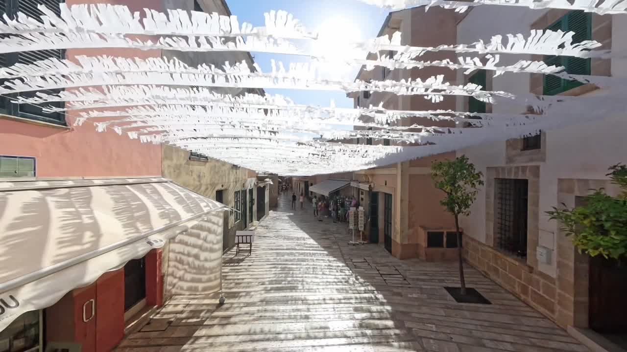 Charming Pedestrian Street with White Fabric Overhead Decorations