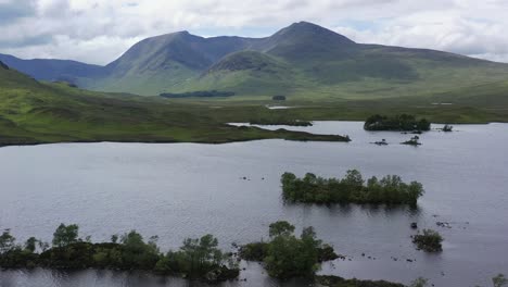 Highland-loch-and-munros,-Lochan-na-h-Achlaise,-Rannoch-Moor,-Highlands,-Scotland,-aerial