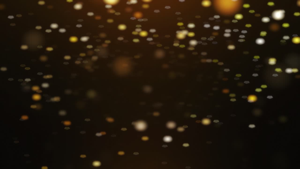 Premium stock video - Gold, glittering particles fade in and out ...