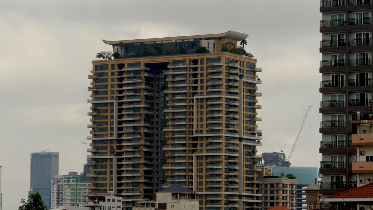 Cloud motion timelapse, high-rise properties, luxury urban accommodation