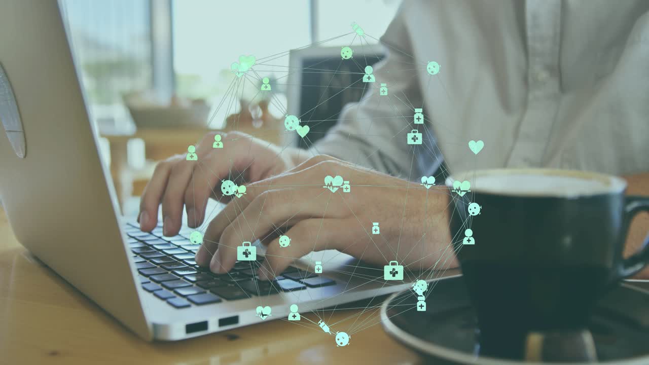 Male tapping smartphone displaying green health icons and typing laptop keys, sending work data