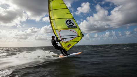 a person windsurfing on the water