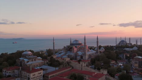 hagia sophia grand mosque - hagia sophia with bosphorus in background during sunset in old town istanbul, turkey