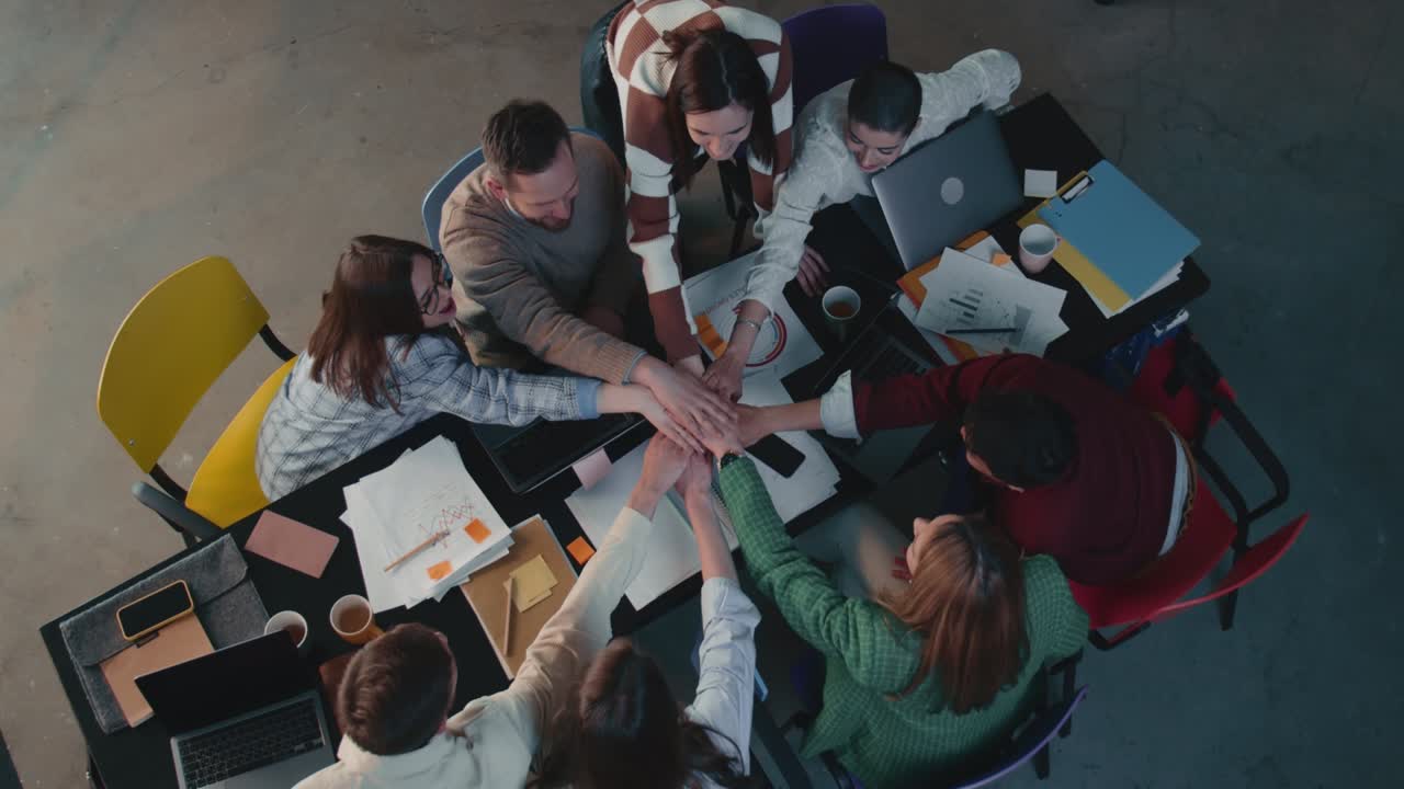 Top view business team join hands, applaud celebrating teamwork success at office work meeting table slow motion.
