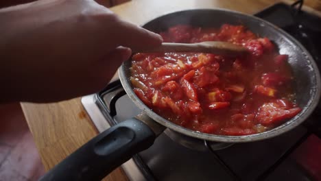 cooking tomato sauce in a kitchen