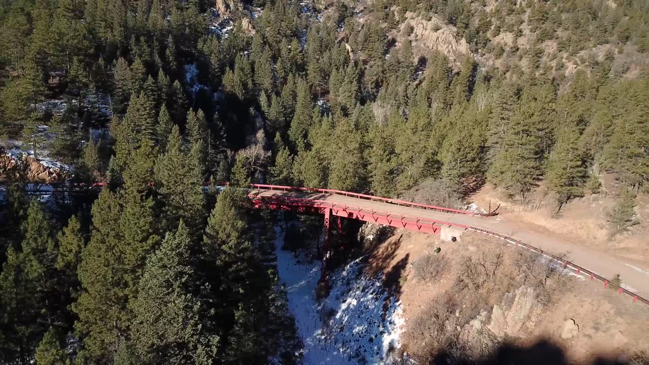 Aerial flight around a road bridge near Cripple Creek Colorado