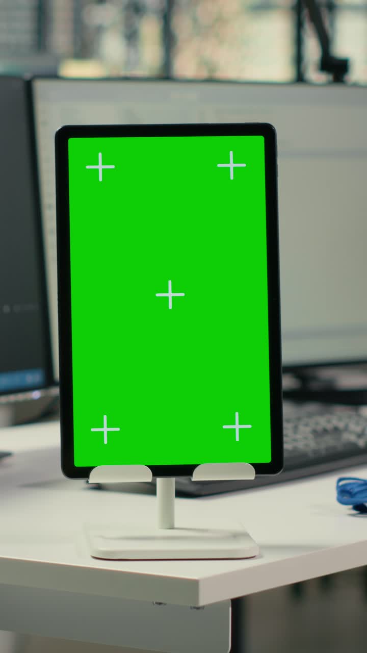 Vertical video Green screen tablet in empty startup office with neural network program running