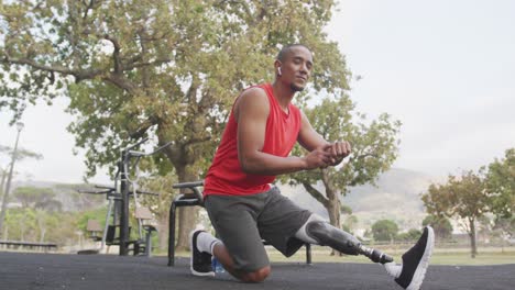 Side-view-man-with-prosthetic-leg-looking-at-his-watch