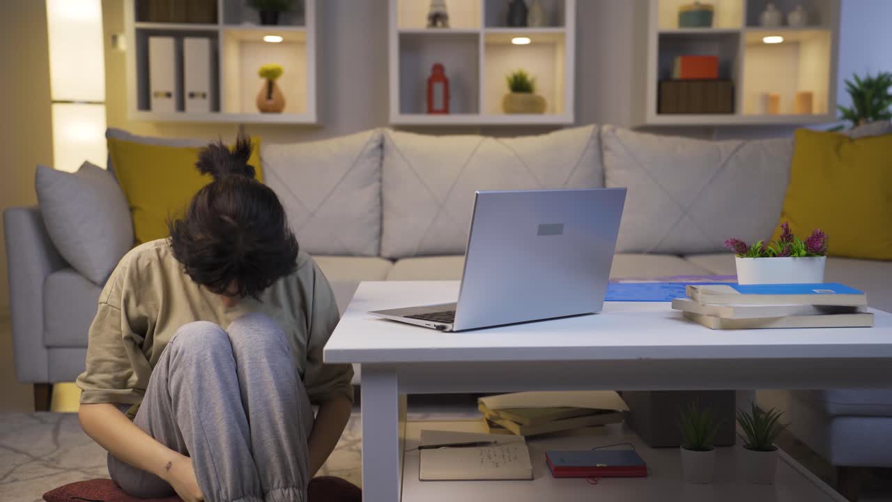 Young woman having a nervous breakdown at home at night.