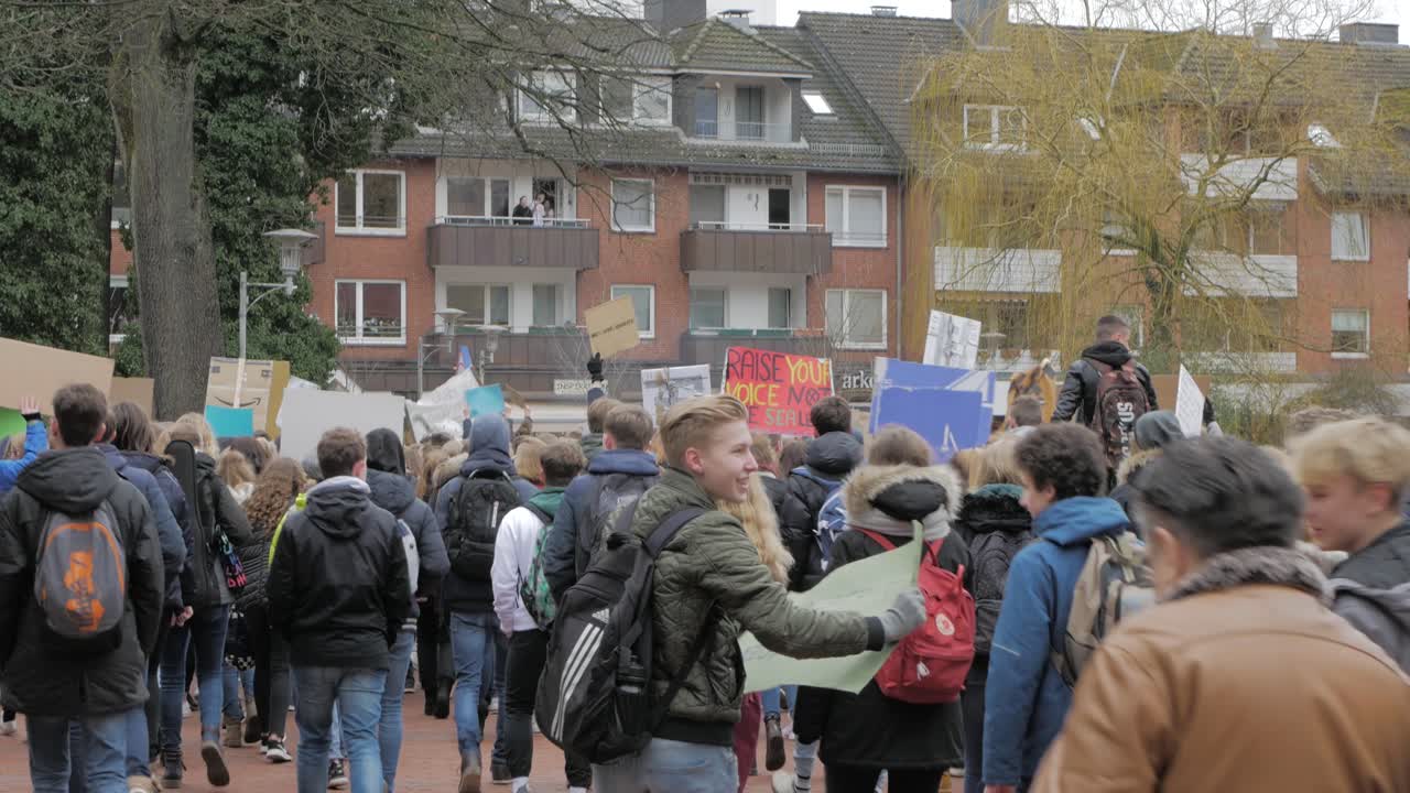 young people demonstrating for enviromental protection