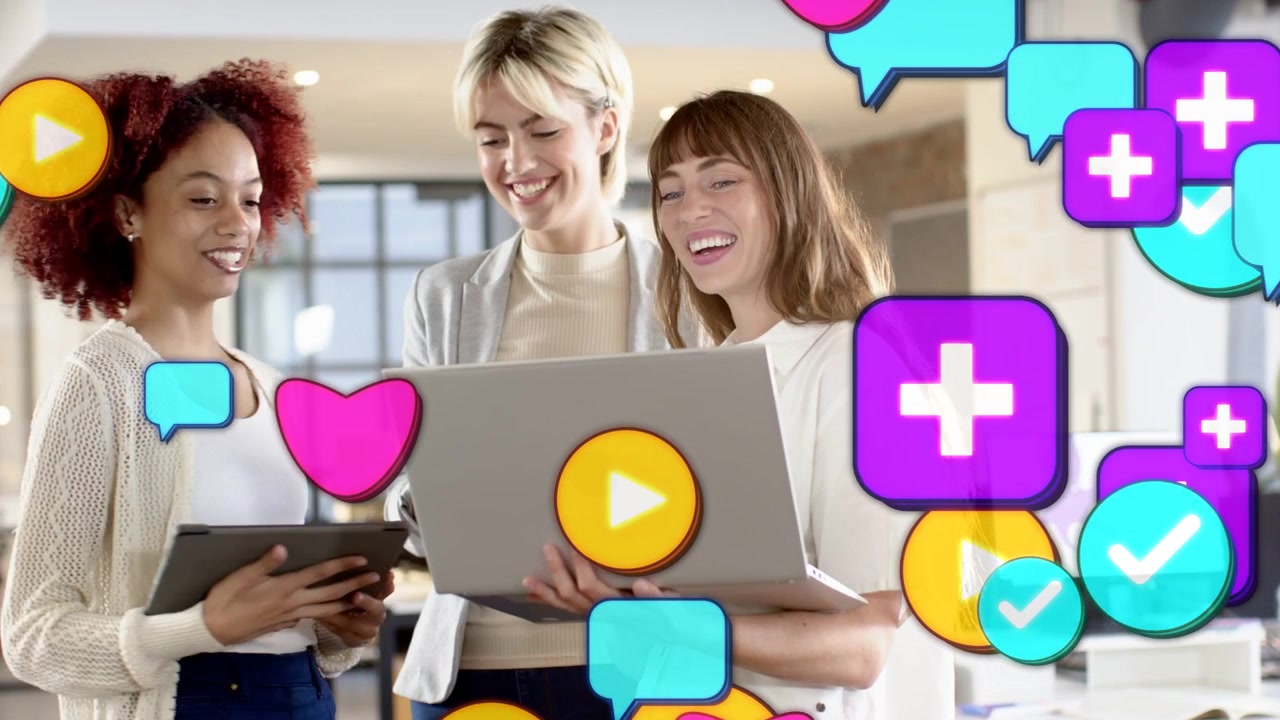 Lead woman pointing at laptop, causing icons to flood foreground, team reviewing marketing