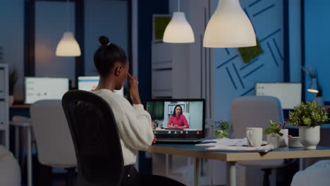 african freelancer working remotely discussing with woman partner online
