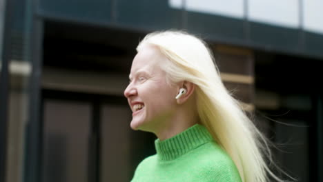 happy woman listening to music outdoors