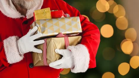 Animation-of-santa-claus-holding-christmas-presents-over-orange-spots-of-light