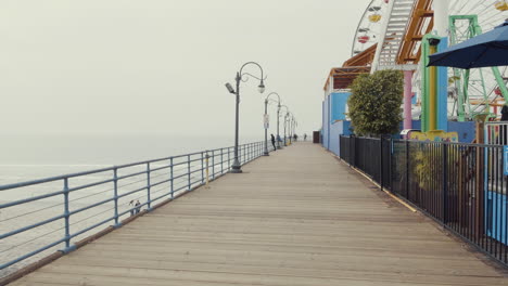 walking by pacific park at santa monica pier california los angeles