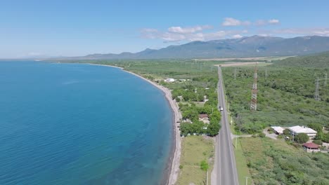 aerial flyover carretera sánchez highway at coastline of azua on dominican republic