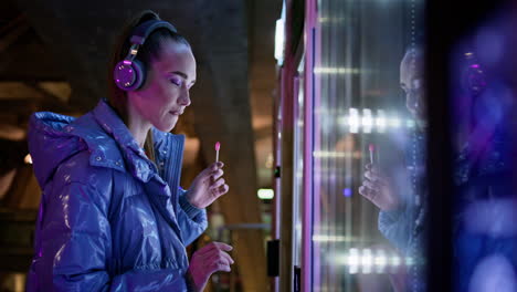 Girl-looking-vending-machine-making-choice-closeup.-Woman-buying-snack-at-subway